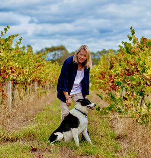 Bellarmine vineyard winemaker Di Miller with Mumford the dog